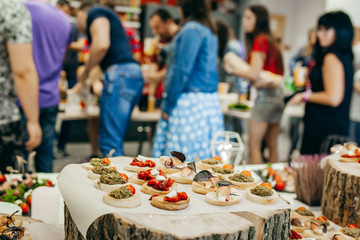 Luxury food and drinks on corporate party table.