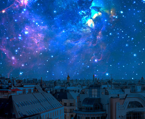 Wall Mural - night sky with many stars over urban city landscape