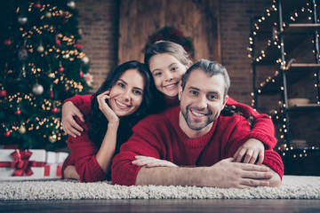 Sticker - Close-up portrait of three nice attractive lovely charming cute dreamy idyllic cheerful cheery peaceful family lying on comfortable carpet festive vacation in industrial loft wood brick style interior