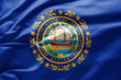 Waving state flag of New Hampshire - United States of America