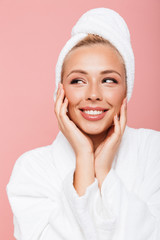 Wall Mural - Arttractive young woman wearing bathrobe and towel