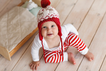 Cute baby wearing christmas clothes is smiling