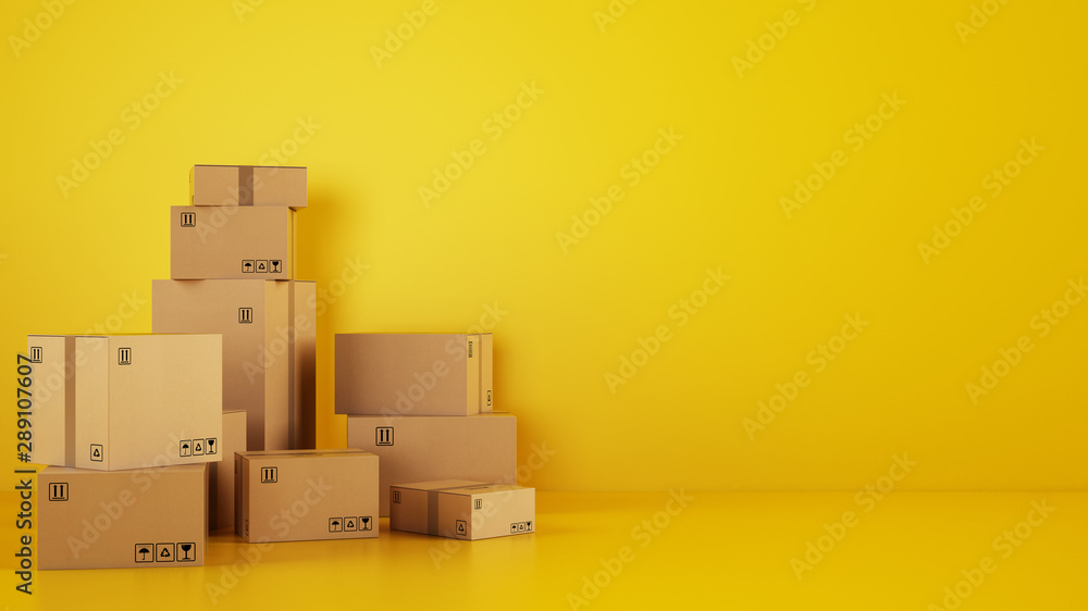 Pile of cardboard boxes on the floor on a yellow background - obrazy, fototapety, plakaty 