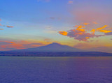 Fototapeta  - Mount Etna volcano on Sicily island, Italy. Panoramic view with sea; sunset; coast and famous Italian mountain.