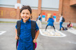 © Louis-Photo - A student school girl on the playground on the first day of class