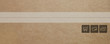 © stokkete - Delivery box closeup with tape and icons