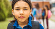 © Louis-Photo - A student school girl on the playground on the first day of class