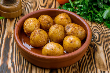 Wall Mural - baked mini potatoes on wooden table