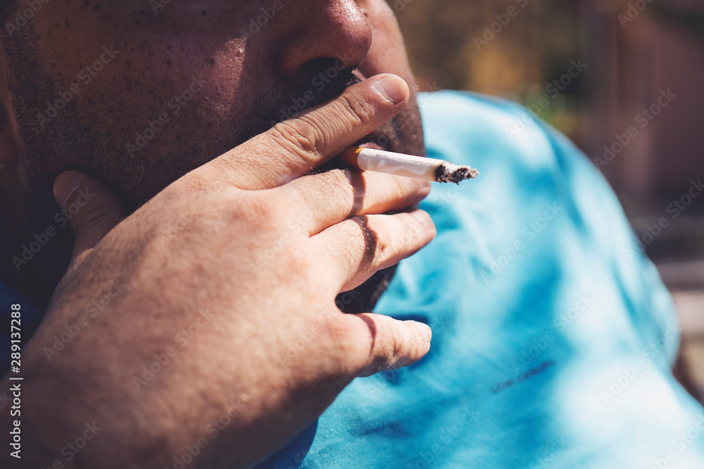 fat cigarettes Fat man smoking cigarette outdoor close up Stock Photo
