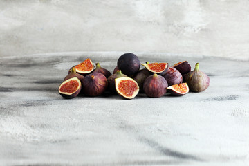 Wall Mural - Fresh figs. Food Photo. whole and sliced figs on beautiful rustic background.