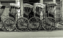 Hand-pulled Rickshaw Parked At The Roadside.  Vintage Effect Is Applied.