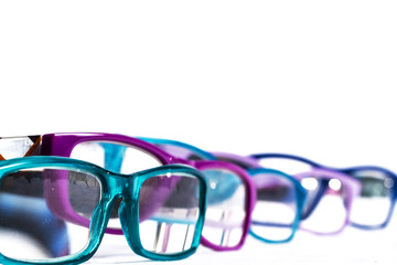 Sticker - multiple colored eye glasses smudged and lined on white background. Eye Health Concept