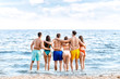 © Pixel-Shot - Happy friends on sea beach at resort