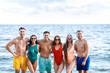 © Pixel-Shot - Happy friends on sea beach at resort