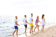 © Pixel-Shot - Happy friends on sea beach at resort