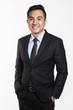 Asian man in office suit posing