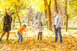 © Angelov - Happy family mother father and baby on autumn walk in the park