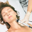 © elenavolf - Dermatology skin care facial therapy. Medical spa anto wrinkles procedure. Woman face rejuvenation. Pretty girl. Rf cosmetician equipment. Chin and neck