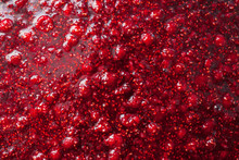 Beautiful Glare Texture Of Raspberry Jam Closeup, Food Background