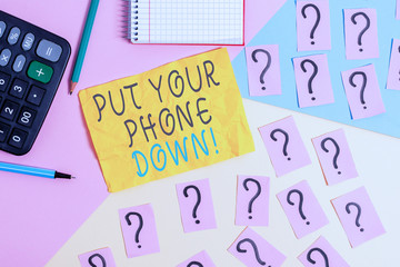 Writing note showing Put Your Phone Down. Business concept for end telephone connection saying goodbye caller Mathematics stuff and writing equipment above pastel colours background