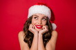© deagreez - Close up photo of charming lady think about noel smiling wear stylish good look isolated over red background