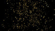 Explosion of gold confetti on an black background