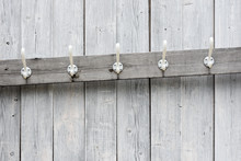 Coat Hooks On The Wooden Panel Wall