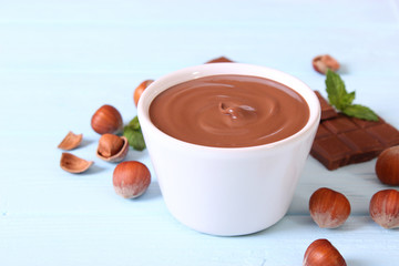 chocolate paste with a bowl on a table.