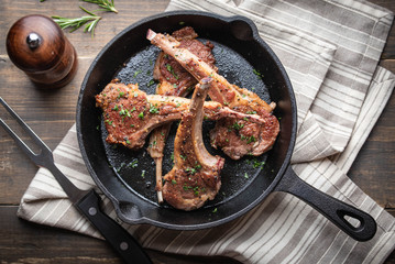 Sticker - grilled lamb chop on cast iron pan