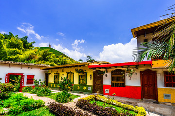 View on colorful colonial buildings nextto botanical garden in the village of Jericho