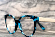 Eyeglasses Glasses with Bifocals and Black Blue Frame Fashion Vintage Style on Wood Desk Background, Rustic Still Life Style...