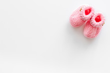 Knitted Pink Footwear For Baby On White Background Top View Mockup