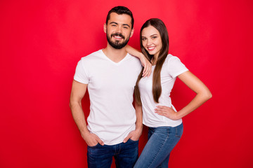 Canvas Print - Photo of two charming nice cute handsome white beautiful people with girlfriend holding her hand on his shoulder and boyfriend standing confidently isolated with red background