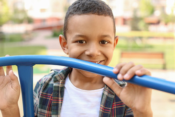 Poster - Cute African-American boy on playground