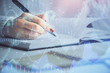 © peshkova - Multi exposure of woman's hands making notes with forex graph hologram. Concept stock market analysis.