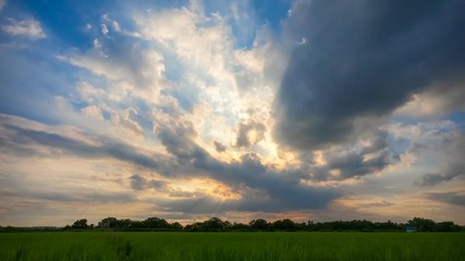 Wall Mural - Time Lapse beautiful landscape sunset over green fields