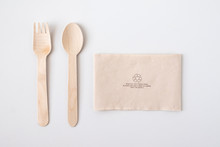 Recycle Eco Friendly Disposable Wood Spoon Fork And Napkin Paper In Top View Isolated On White Table Background.