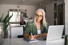 Senior Fashionable Woman Working At Home
