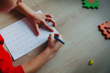 Wall Mural - little boy learning write and culculate numbers