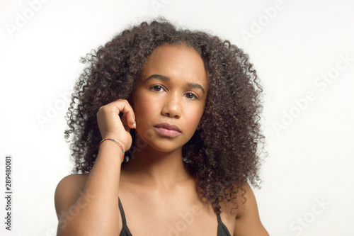 Closeup Portrait Of Young Mixed Race Model With Curly Hair In