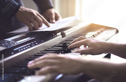 Cuadros en Lienzo Piano teacher and student practising