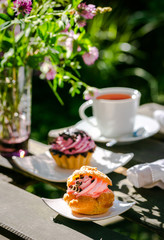 Wall Mural - Summer dessert tea drinking five o'clock in the sunny garden