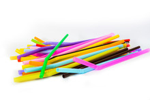 Used Plastic Straws In A Variety Of Colors, Isolated Over The White Background For Copy Space.