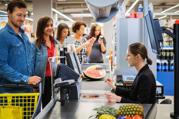 People buying goods in a grocery store