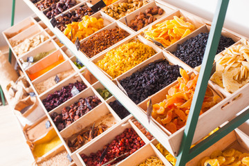 Sticker - Colorful dried fruits assortment on a rack at the store