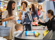 © Nejron Photo - Woman buying goods in a grocery store