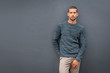 © Rido - Casual fashionable man against grey wall