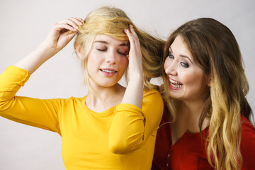 Wall Mural - Two girls creating hairdo. Hair ombre color