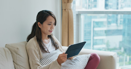 Poster - Woman use of tablet computer at home