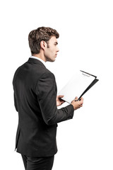 Wall Mural - Side view of businessman with clipboard